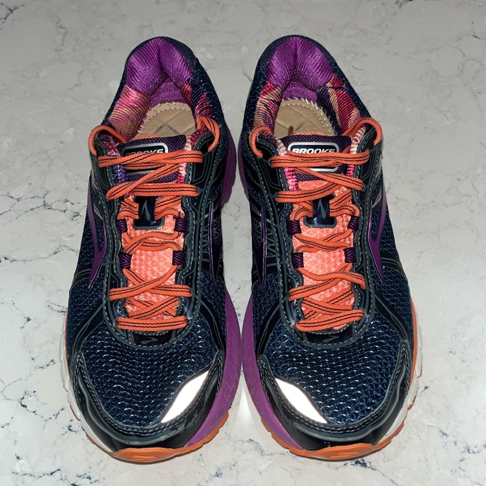 Brooks GTS running shoes in purple and salmon